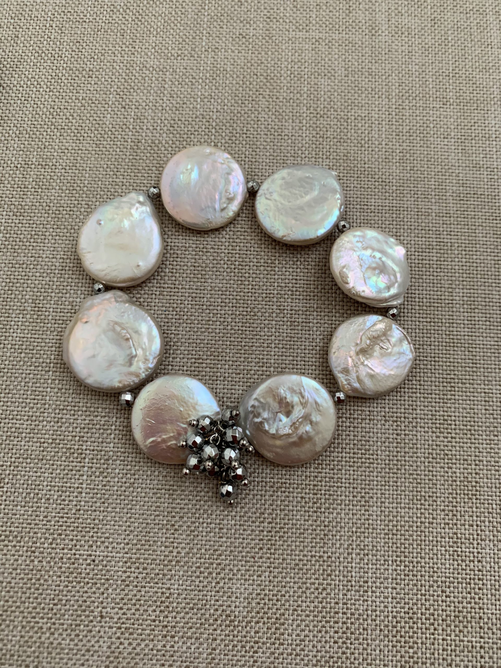 Bracciale elastico perle piatte, ematite e argento rodiato