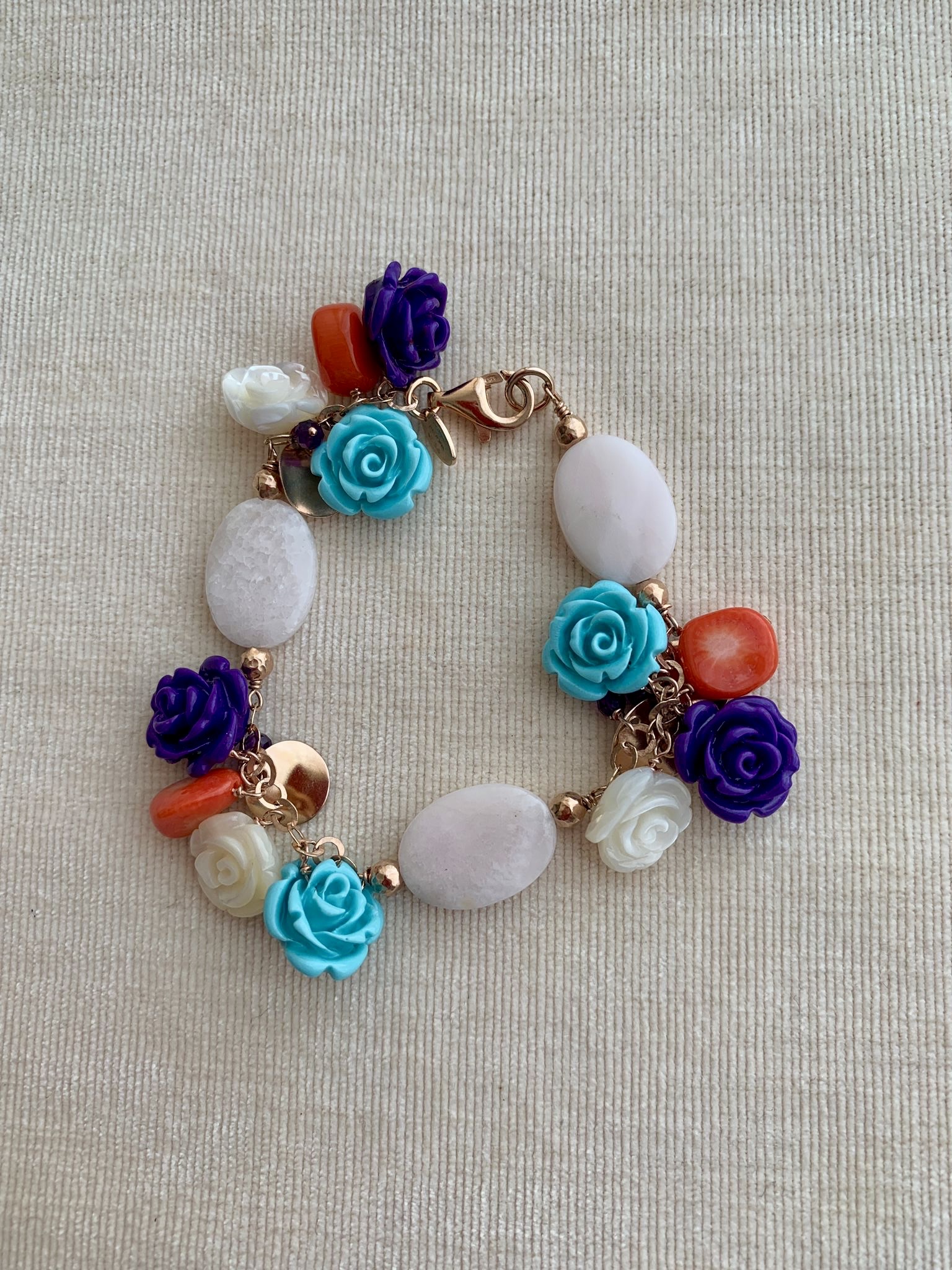 Bracciale in argento placcato oro rosa con ovali in mangano  e roselline